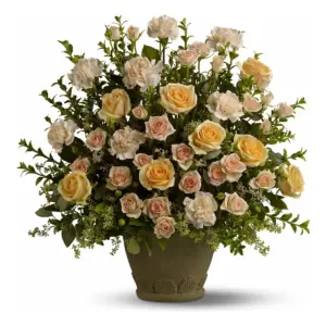 Peach roses and cream carnations in an olive stone-look pot with greenery