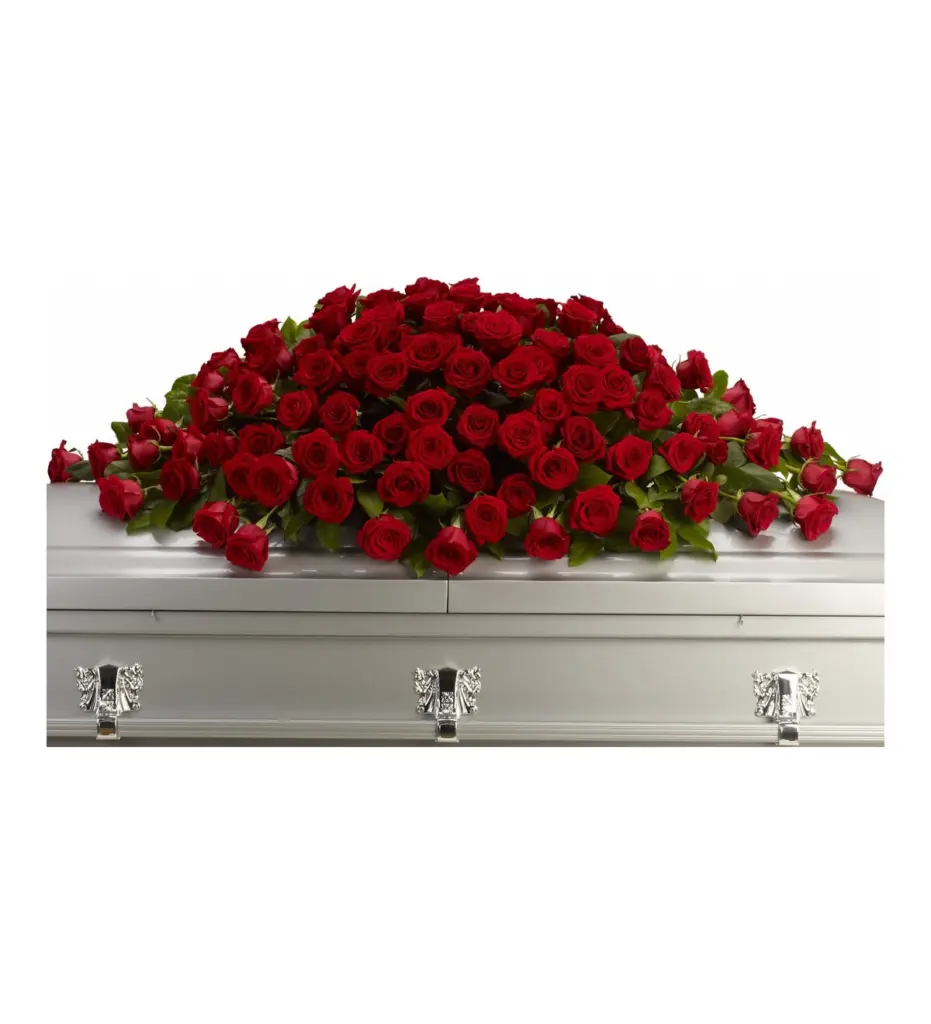 Full red rose casket spray resting on a silver casket lid