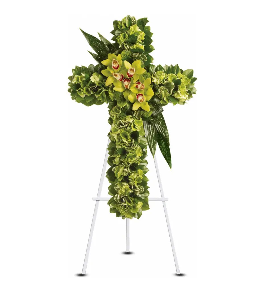 Green hydrangea cross with green orchids at the center on a white easel