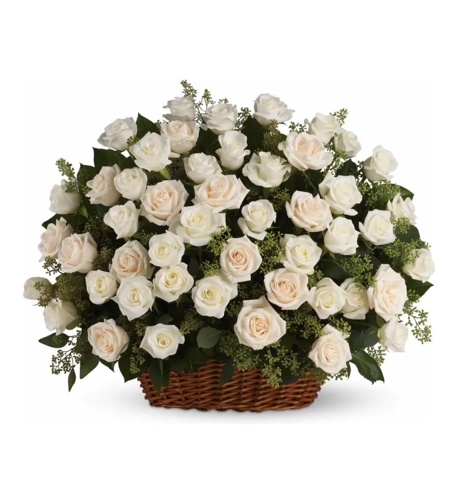 Wicker basket filled with white and cream roses and seeded eucalyptus