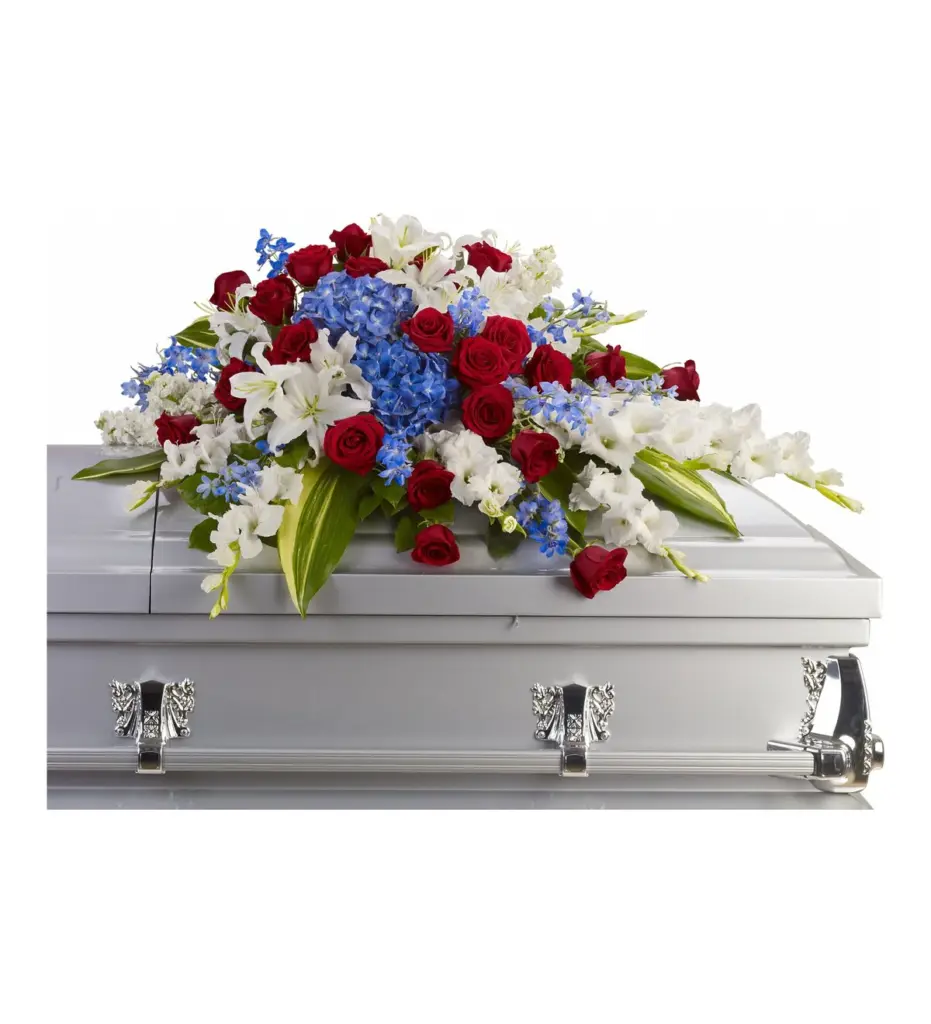 Red, white and blue half casket spray of roses and hydrangea on a silver casket