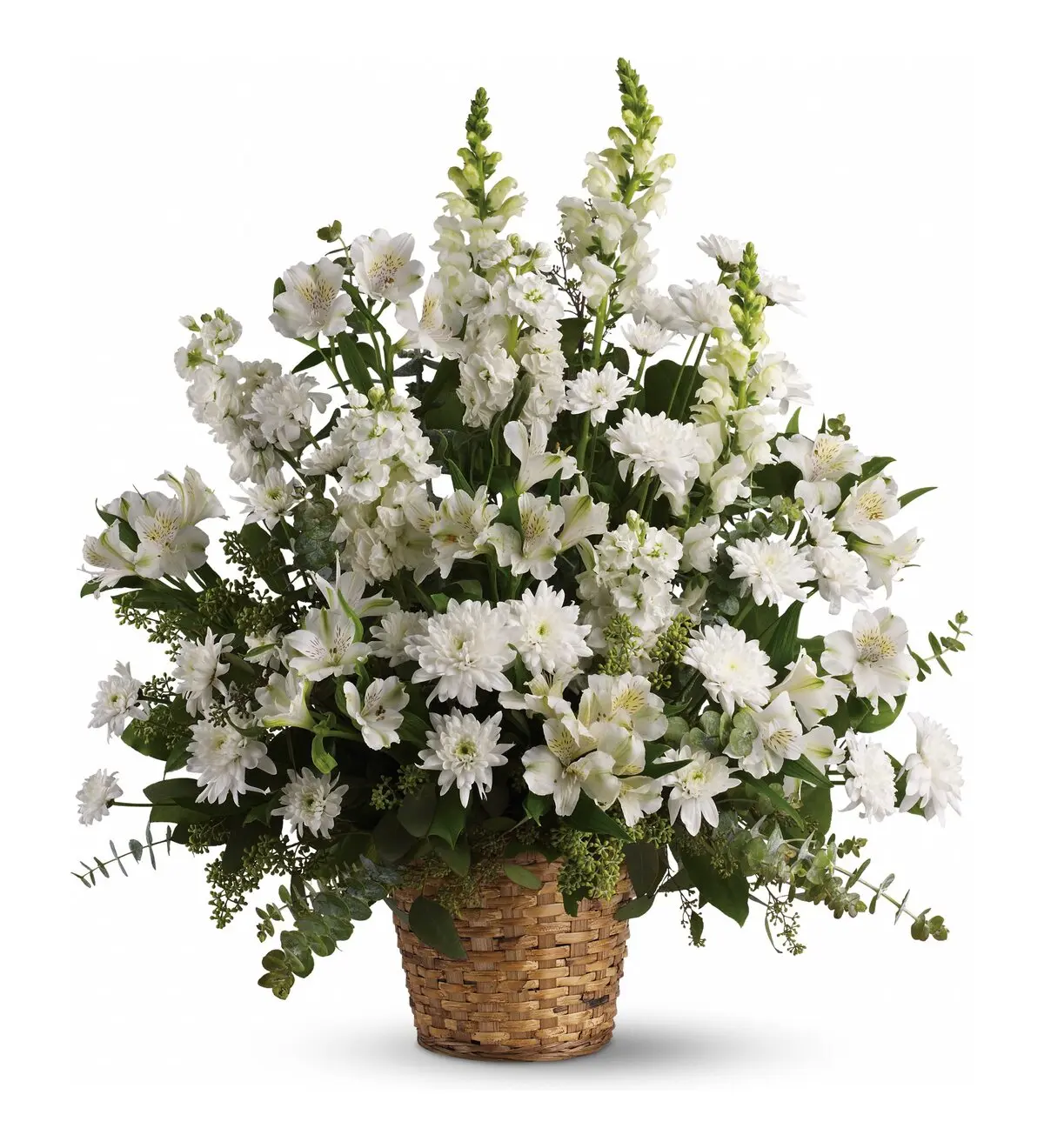 Tall white snapdragons, stock and mums in a woven floor basket