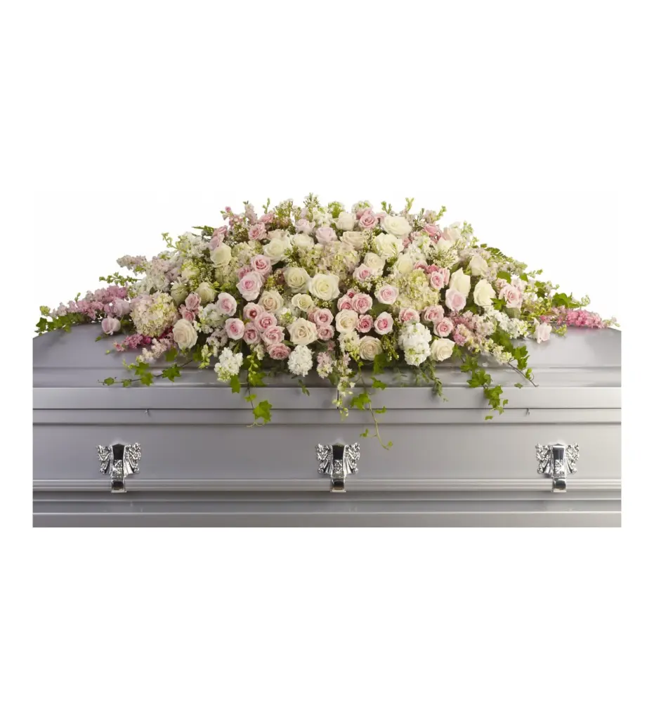 Pink and white casket spray of roses and hydrangea on a silver casket