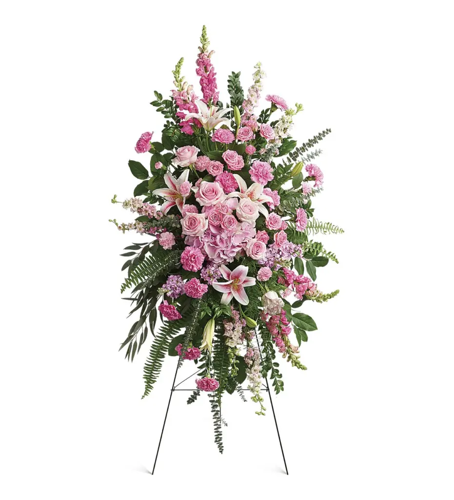 Pink roses, lilies and hydrangea standing spray on a wire easel