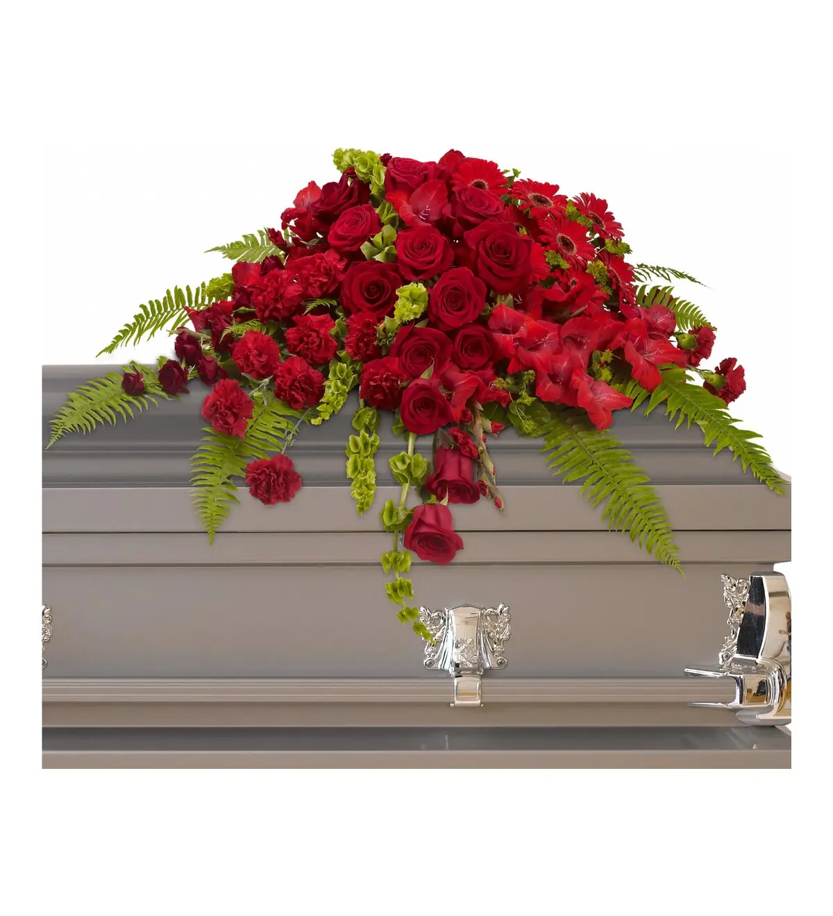 Red rose and gerbera half casket spray on a gray casket lid
