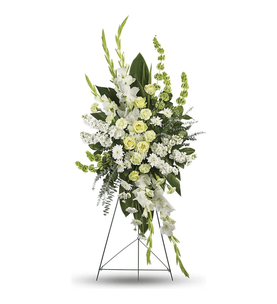Tall white and green standing spray with gladiolus and roses on a wire easel