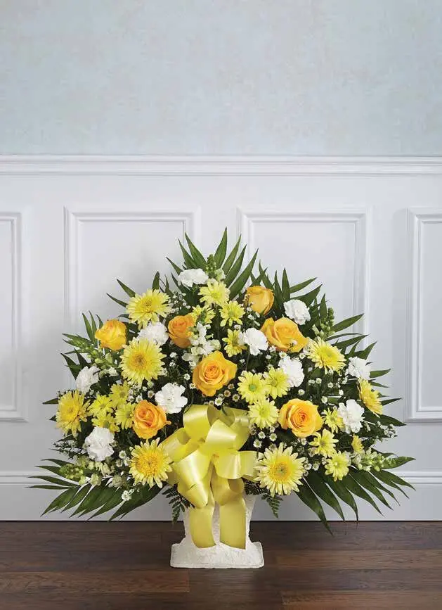 Yellow and white floor basket of roses and daisies with a yellow satin bow