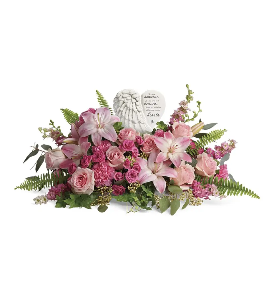 Pink lilies and roses around a white angel-wing heart plaque with verse