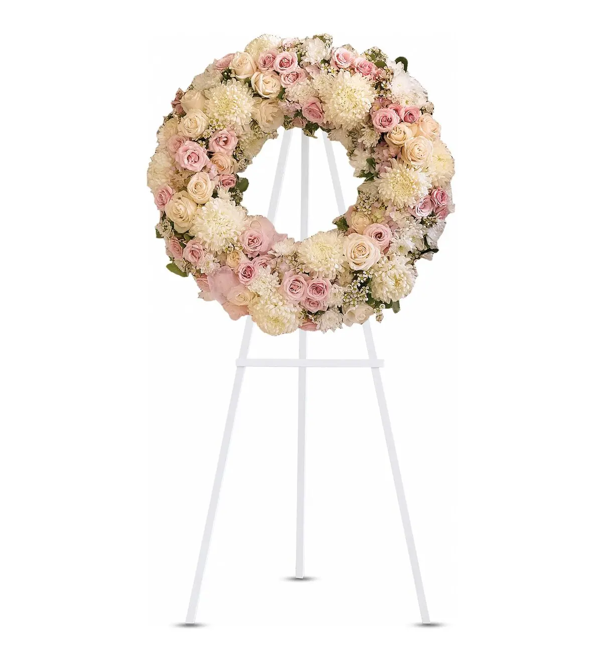 Blush pink and cream wreath of roses and white mums on a white easel