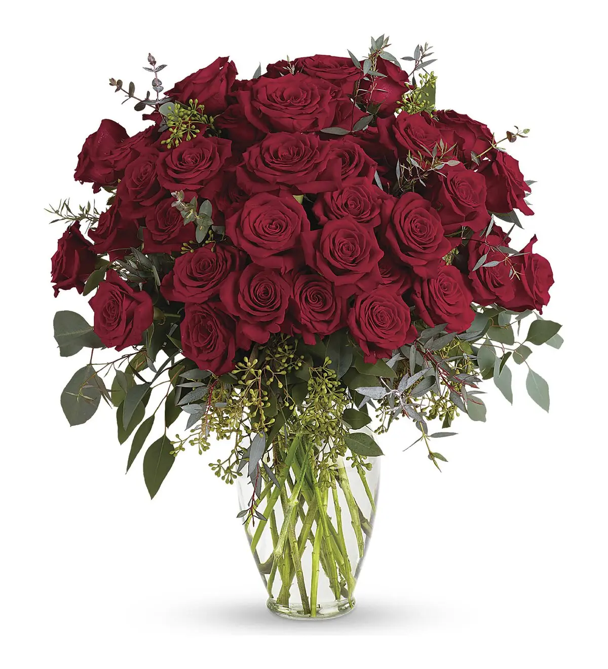 Clear glass vase filled with deep red roses and eucalyptus