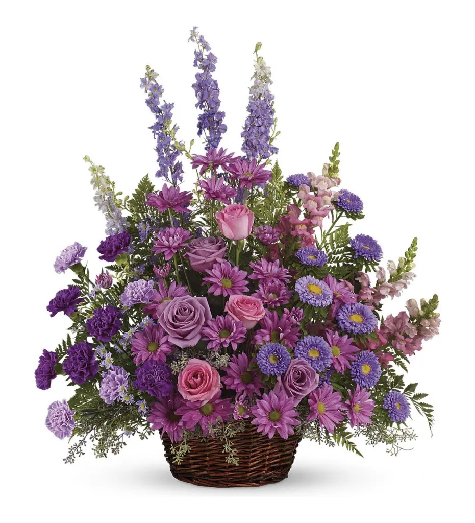 Wicker basket of lavender larkspur, roses and purple daisy mums